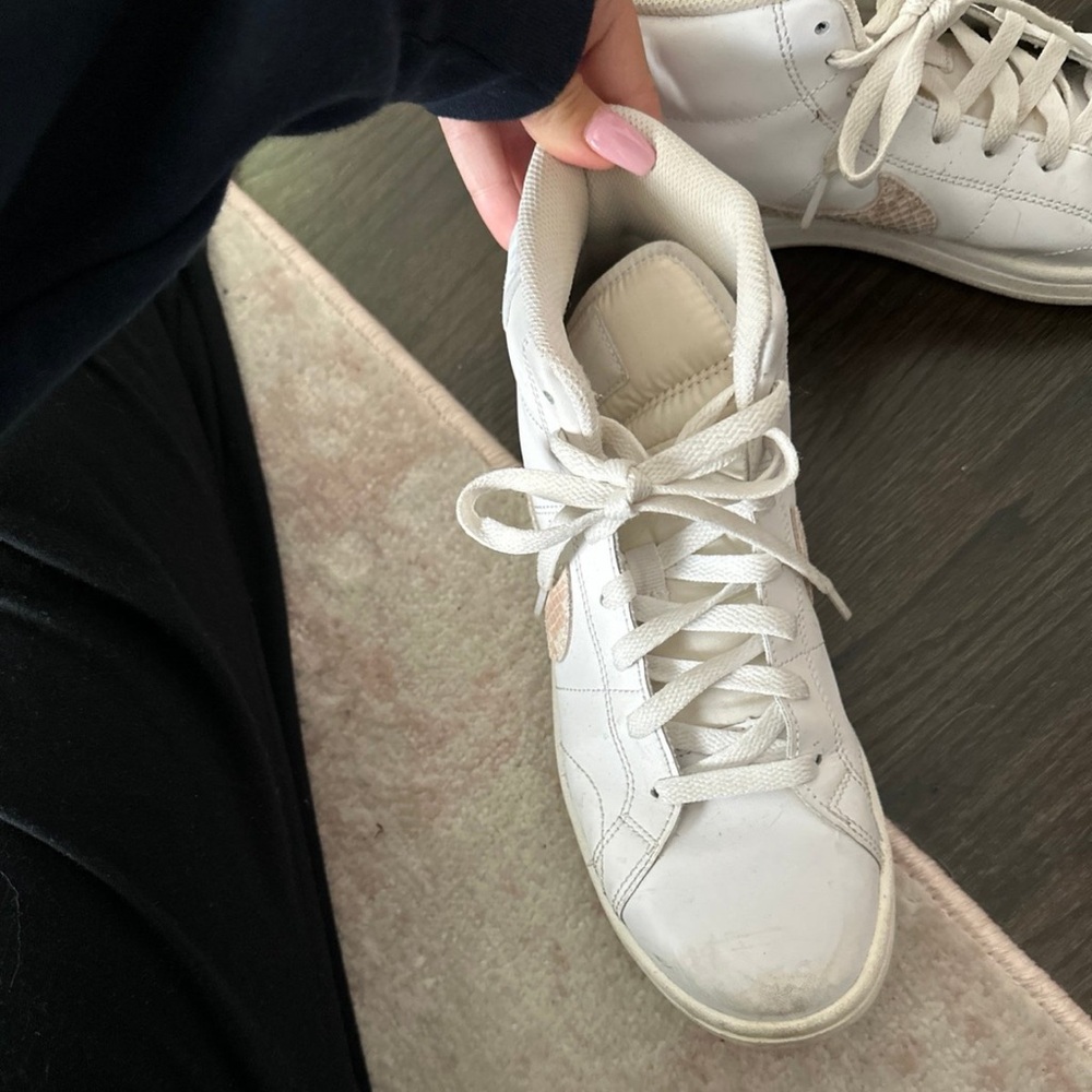Lightly worn Nike high top sneakers. It has tan snakeskin pattern on it.
